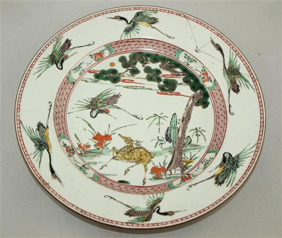 A Chinese famille verte deer and crane dish, Kangxi period, 32cm., section broken and re-stuck